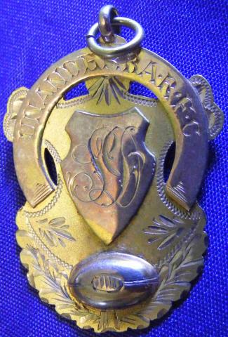 Front side of a football medal for James Ducksbury