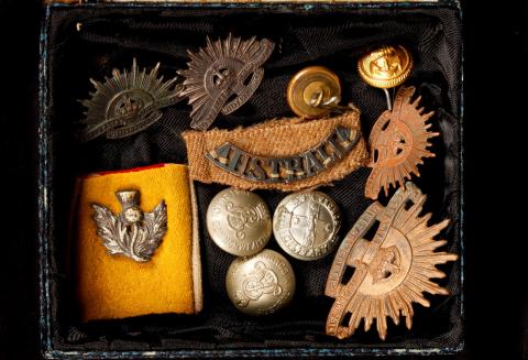 Picture of army buttons in display.