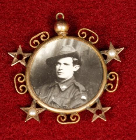 Medal featuring a black and white portrait of Edwin Street in uniform.