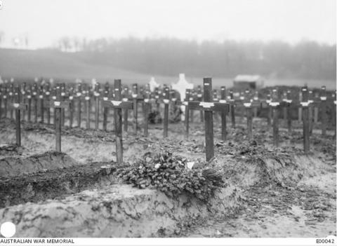 Black and white photograph of grave markers.