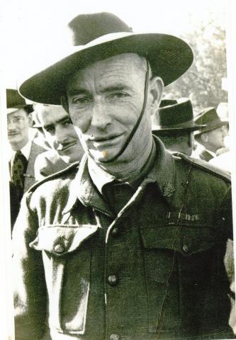 Sepia photograph of William George outdoors in uniform.