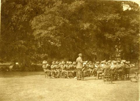 Sepia photograph of the band playing together. 