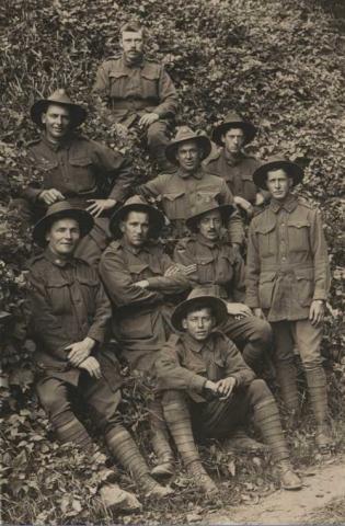 Eddie Stewart sepia photograph with comrades.