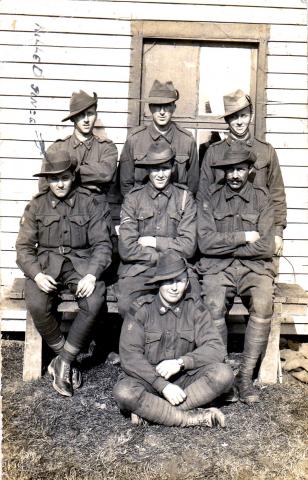 Black and white photo of six men in uniform with David Morgans