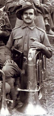Richard McDonald posing with a tuba