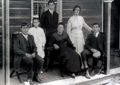 Six people posing for a photograph.