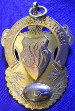 Front side of a football medal for James Ducksbury