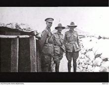 Black and white photo of three officers in uniform