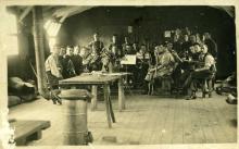 Sepia photograph of a group of men in uniform.