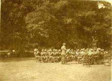Sepia photograph of the band playing together.